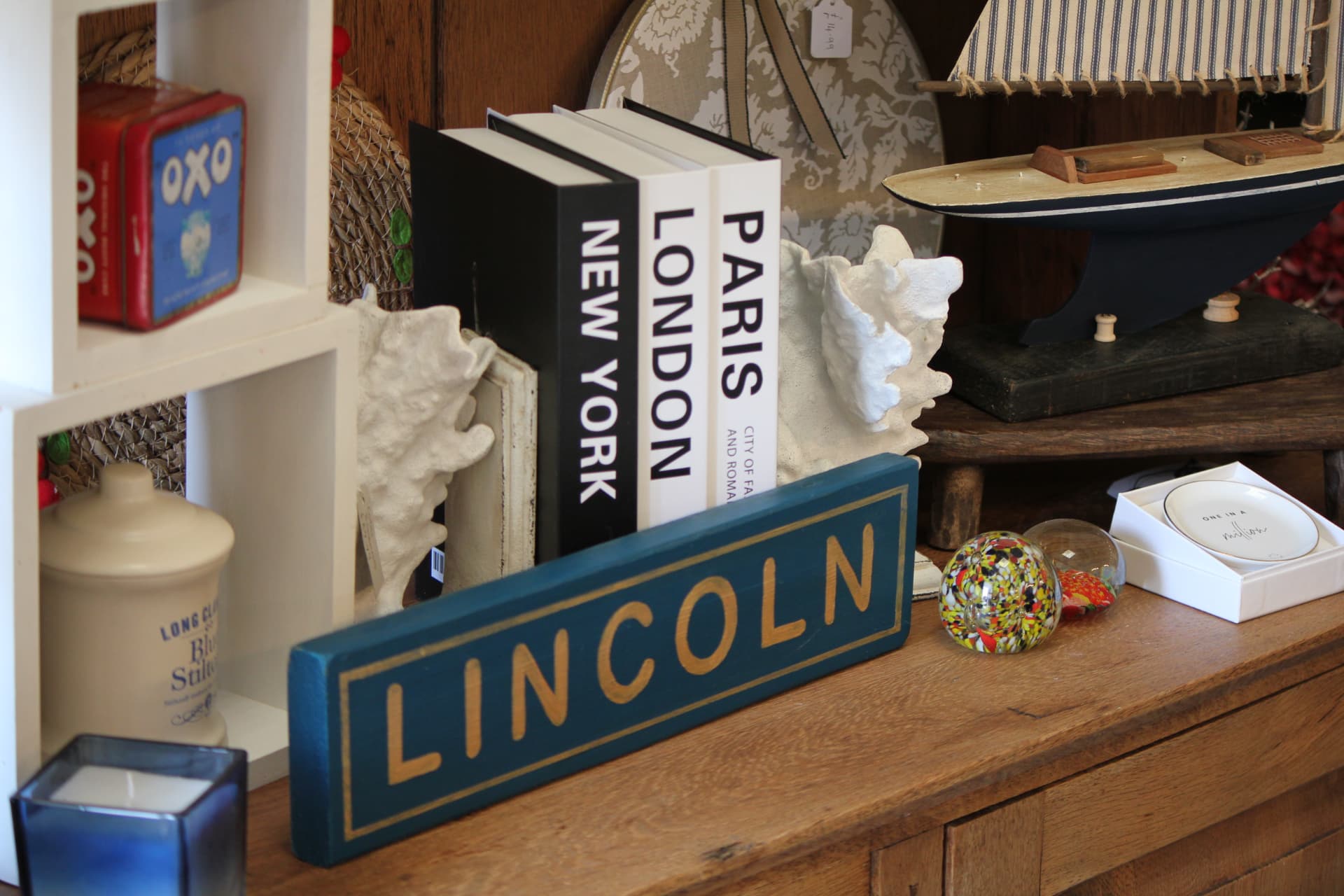 Vintage Lincoln sign with coastal decorative pieces