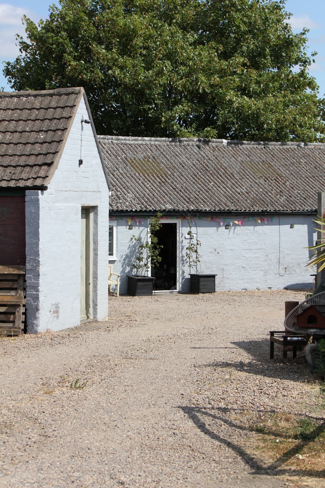 The gravel courtyard leading to the shop entrance