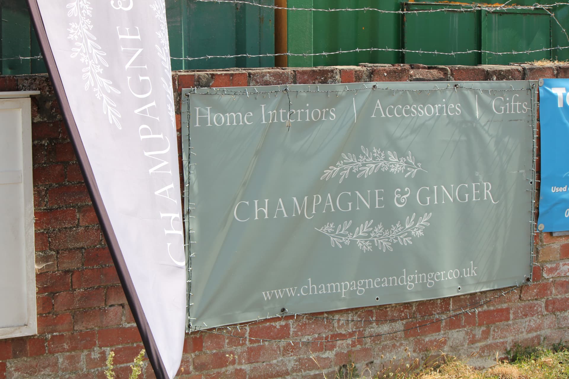 The Champagne & Ginger banner and flag at the entrance